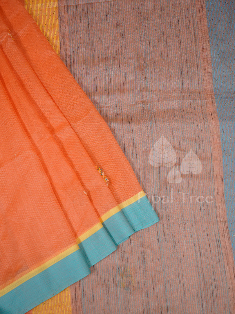 peach kota with a blue pallu
